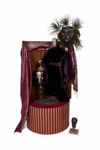 a person holding a lid of a jar on a stage