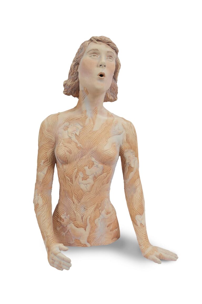 A sculpture of a woman with half her body and a acrylic design on her.