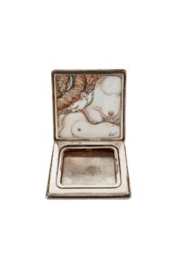 opened box containing an erotic illustration