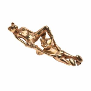 erotic sculpture of two gold figures laying down