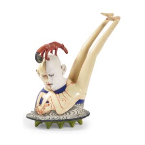 sculpture of a nude person and a head resting on top of them