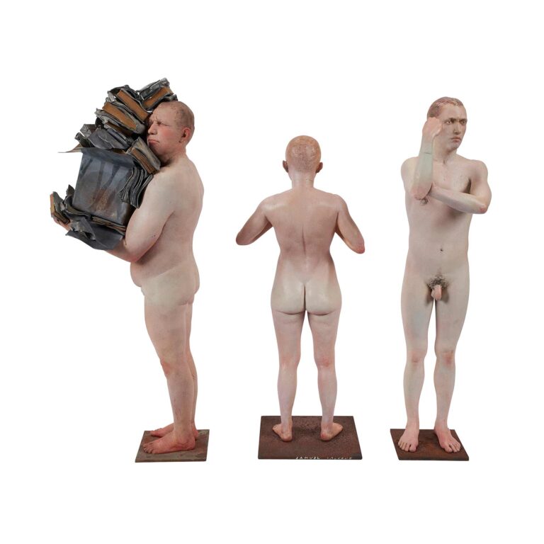 Sculptures of three naked men.