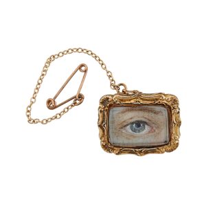 gold jewelry with a frame of an eye