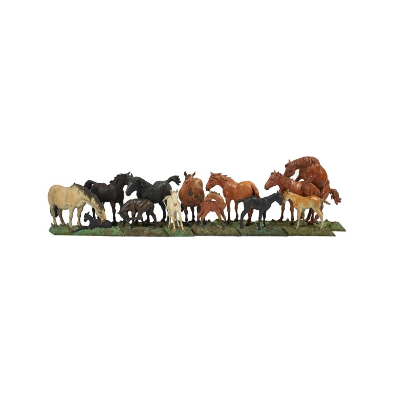 A sculpture of a group of horses.