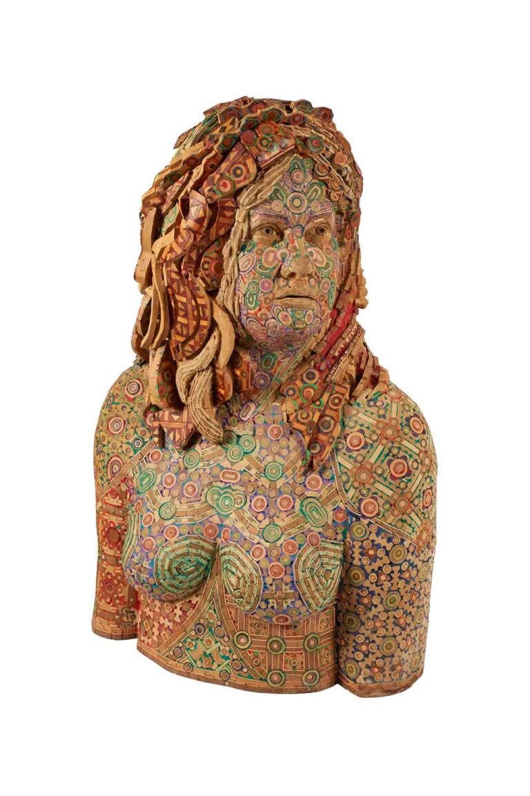 A wooden sculpture of a woman.