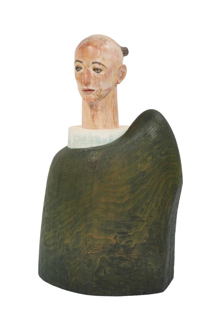 A wooden sculpture of a figure.