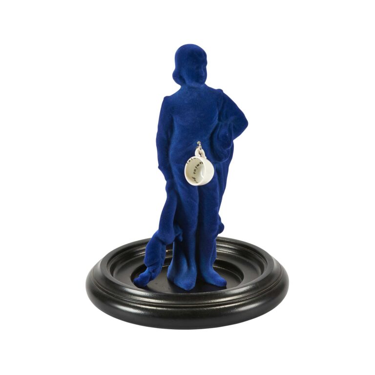 A sculpture of a blue figure.