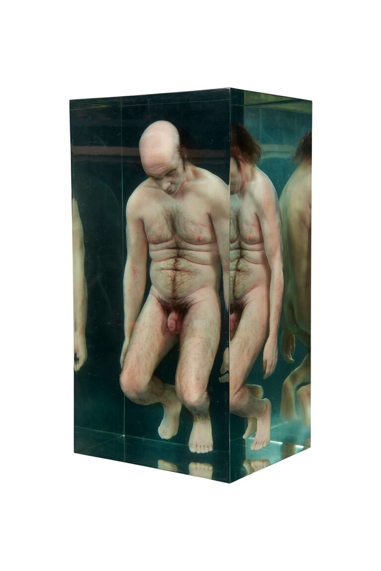 A sculpture of a person inside resin.