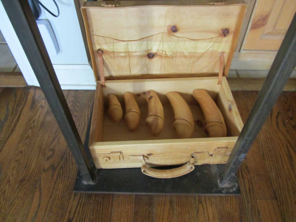A wooden erotic briefcase.