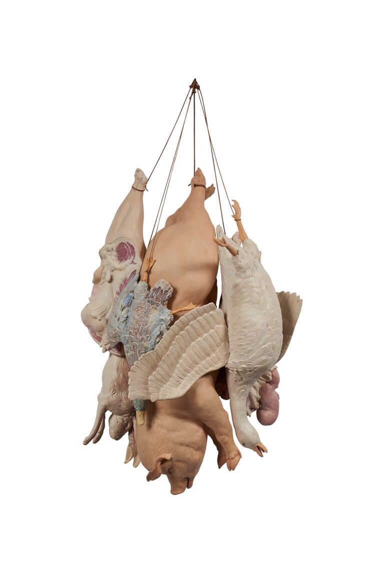 A ceramic sculpture of animals hanging.