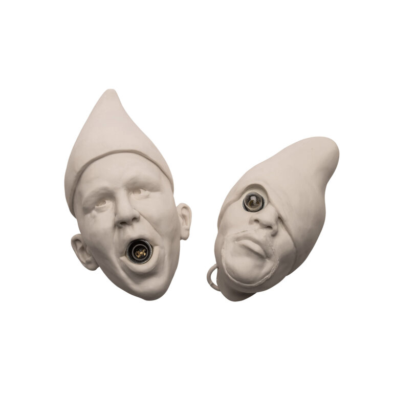 Two ceramic head of figures.
